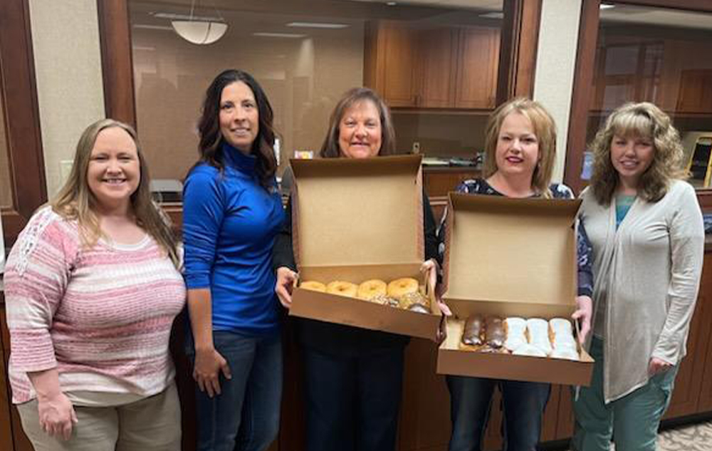 Humboldt employees with donuts for Donut Day.