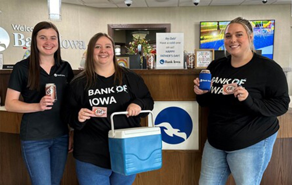 3 Lawler branch employees holding root beer.