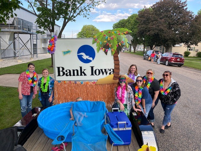 People standing with parade float