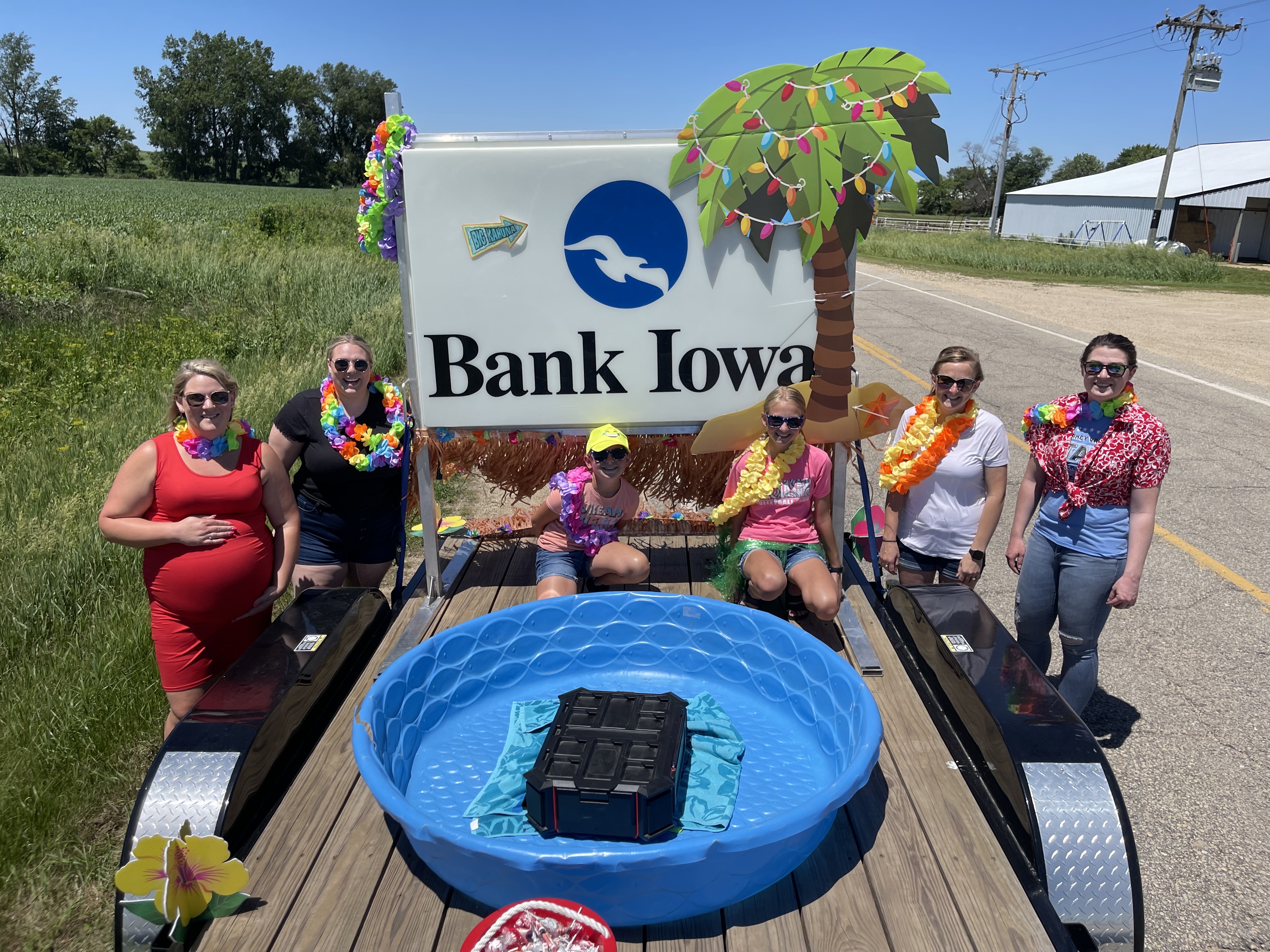 People standing around a parade float smiling