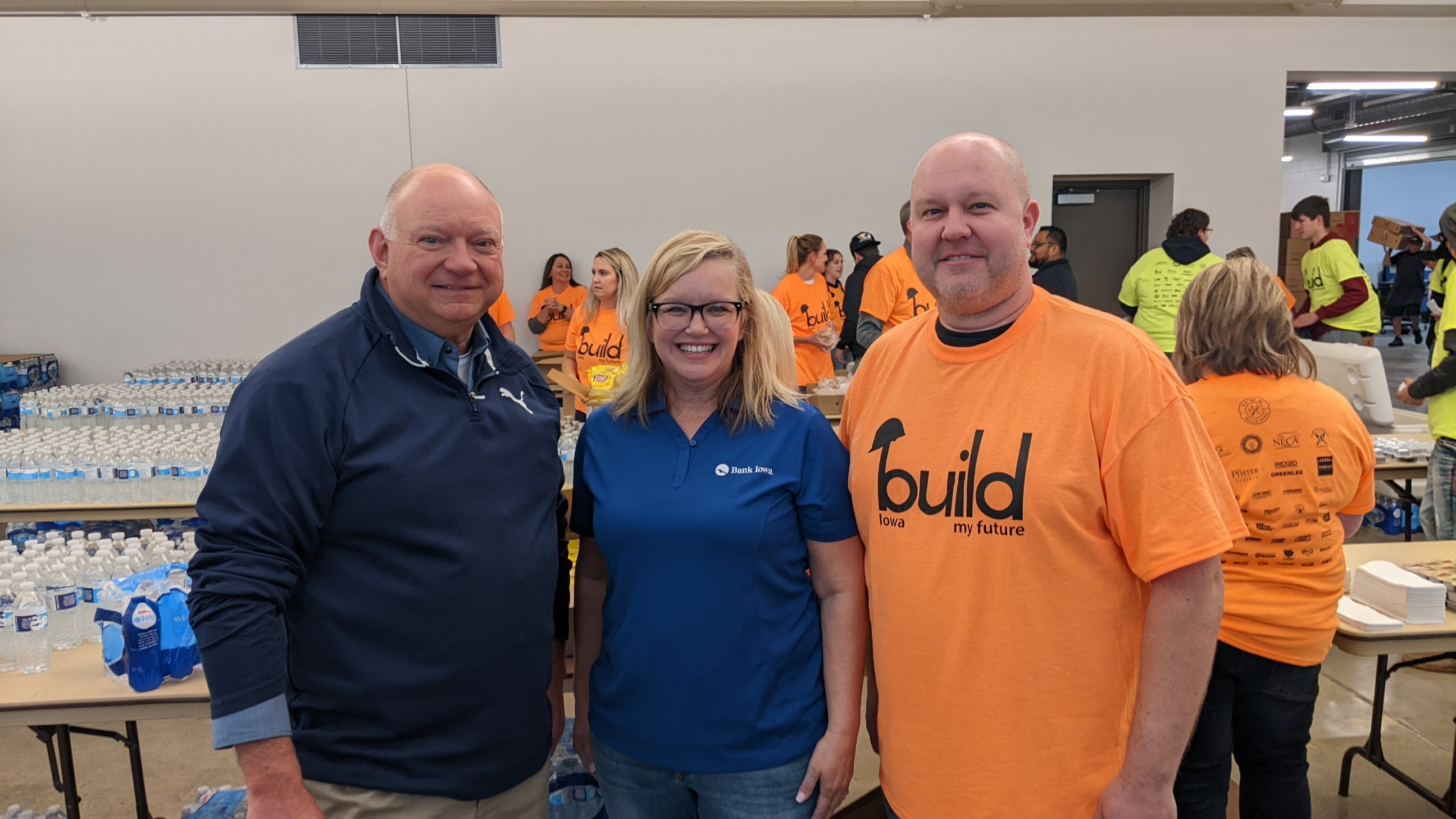 Bank Iowa team members volunteering to serve food at th