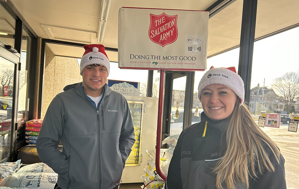 Two Lawler branch members with the iconic red kettle.